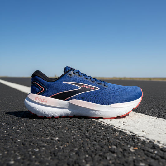Blue running shoe with white sole on a white background