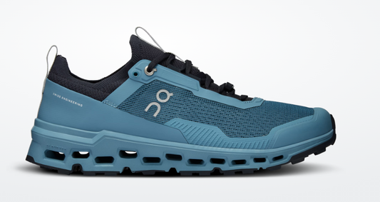 Blue running shoe with brand logo on a white background