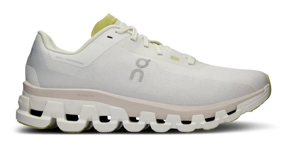 White running shoe with a unique sole design on a white background