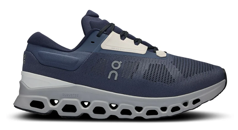 Navy running shoe with white sole on a white background
