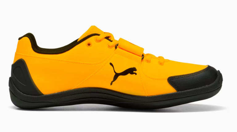 Yellow and black Puma sneaker on a white background