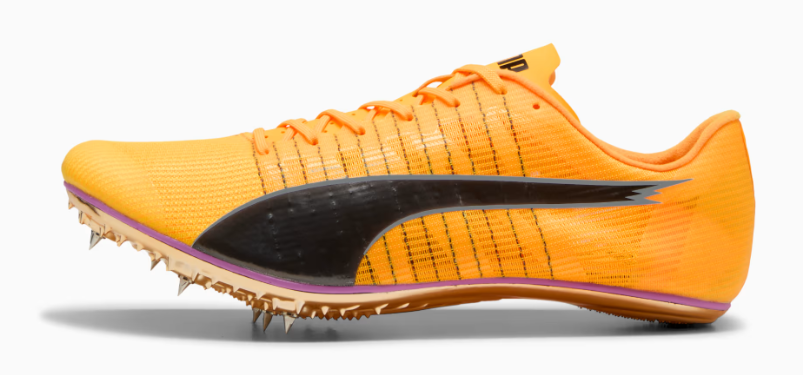 Orange running shoe with spikes on a white background
