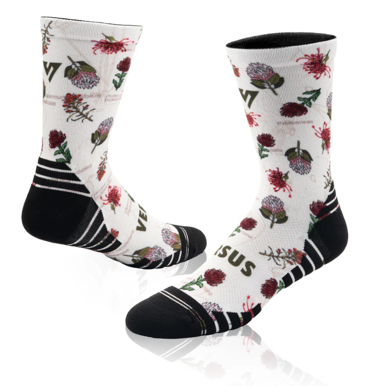 Floral patterned socks with black accents on a white background