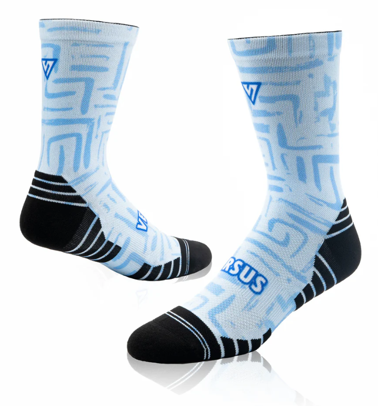 Pair of socks with blue geometric pattern and black toes and cuffs on a white background
